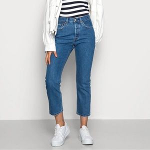 Levi’s 501 high-waisted medium-wash jeans. 💙